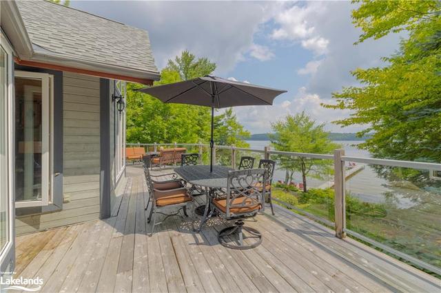 Walkout to lakefront deck from the sunroom | Image 5