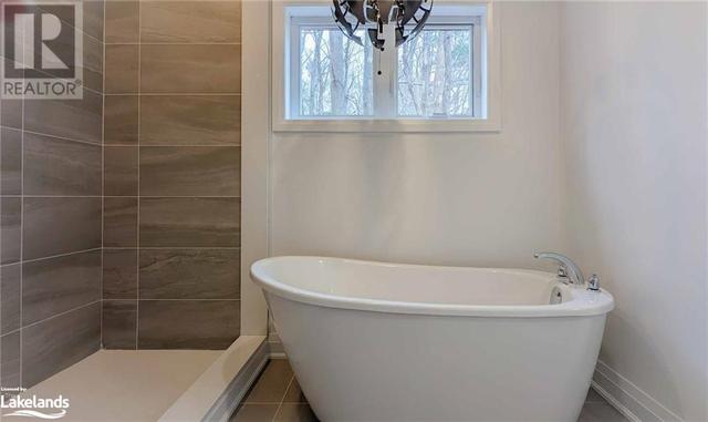 Primary ensuite with soaker tub and walk in shower | Image 16