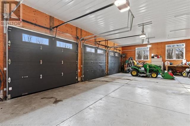 3 car heated garage with a separate entrance to lower level | Image 40