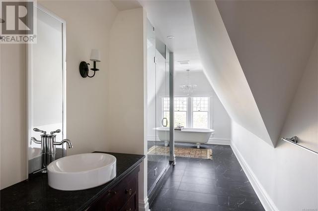 Large third level bathroom with heated floors and claw foot tub | Image 41