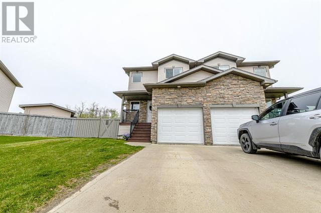 11202 71 Avenue, House semidetached with 2 bedrooms, 2 bathrooms and 2 parking in Grande Prairie AB | Image 2