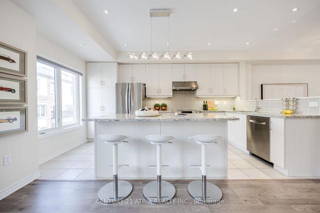 28 Coneflower Cres, House attached with 4 bedrooms, 4 bathrooms and 2 parking in Toronto ON | Image 4