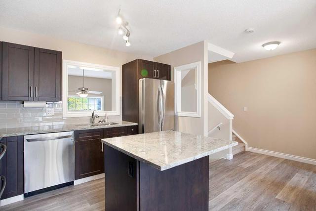 71 Cougar Ridge Mews Sw, Home with 2 bedrooms, 1 bathrooms and 2 parking in Calgary AB | Image 11