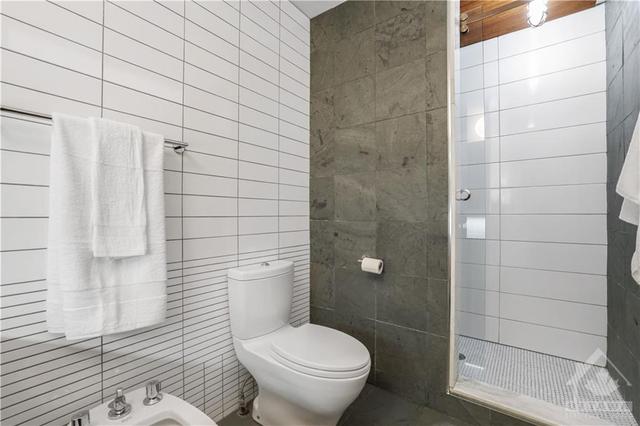 En-suite Bathroom with 6 ft. walk in shower - slate and white tile. | Image 21