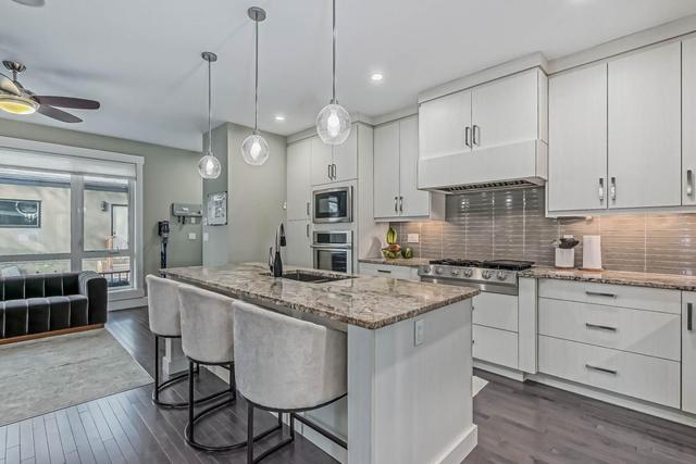 2611 36 Street Sw, Home with 4 bedrooms, 3 bathrooms and 2 parking in Calgary AB | Image 3