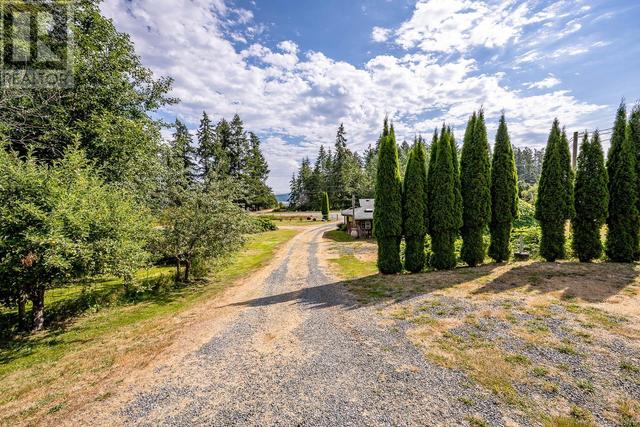 8185 Island Hwy S, House detached with 4 bedrooms, 4 bathrooms and 6 parking in Comox Valley A BC | Image 10