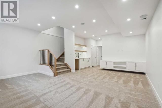 The craftsmanship and attention to detail continues into the fully finished basement, with wet bar, 4th bedroom and 3 piece bathroom and huge bonus room with more built in storage | Image 41