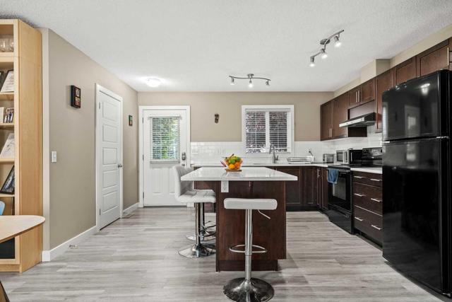 593 Panatella Boulevard Nw, Home with 3 bedrooms, 1 bathrooms and 2 parking in Calgary AB | Image 7