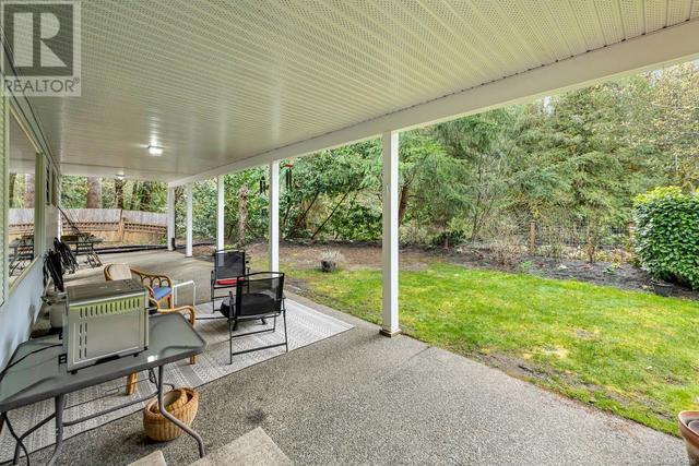 Covered patio accessed from the living room is ideal for year round use | Image 22