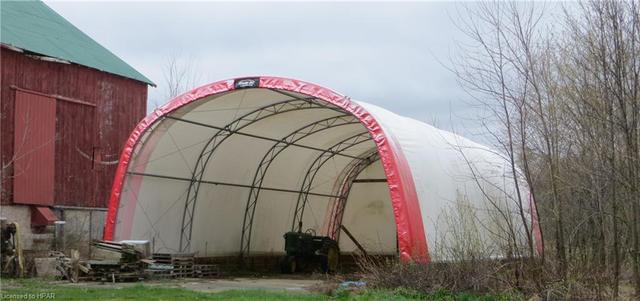 Coverall building (2000’s), approximately 30’x56’, with concrete floor, steel frame & fabric cover. | Image 5