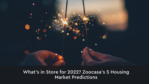 Hands holding sparklers with text "What's in Store for 2022? Zoocasa's 5 Housing Market Predictions"