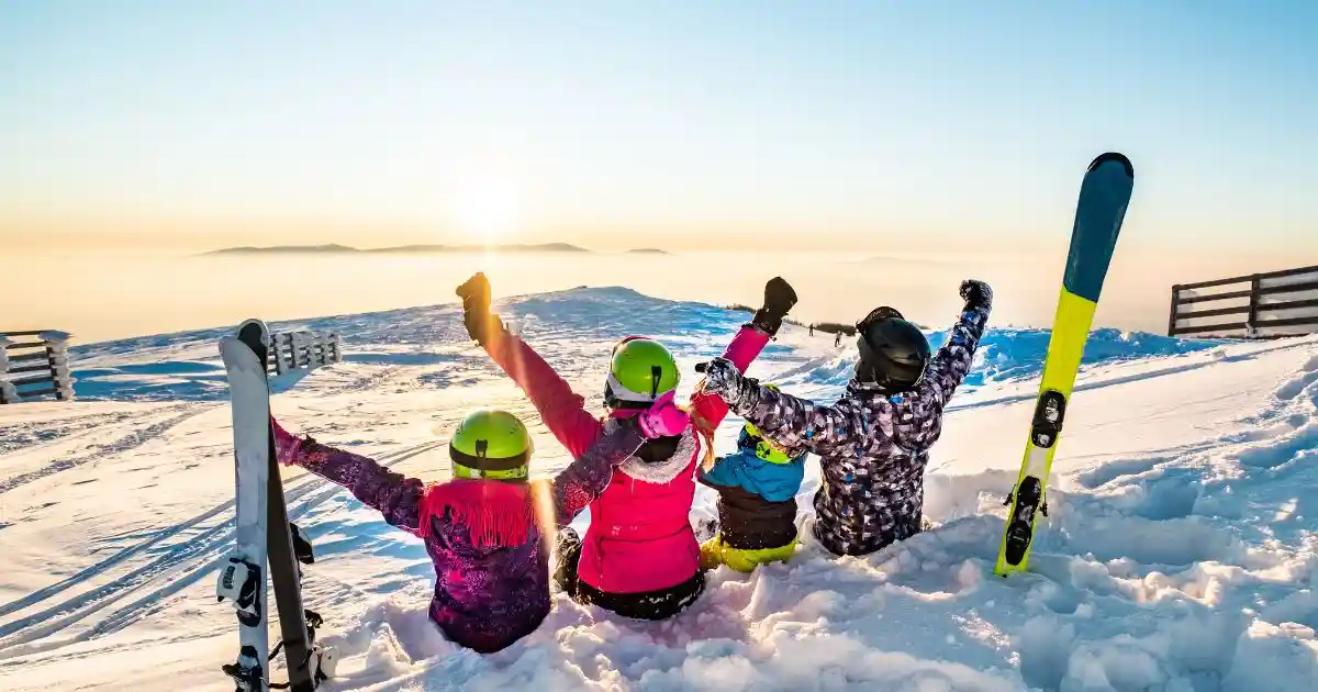 skiers enjoying a sunset