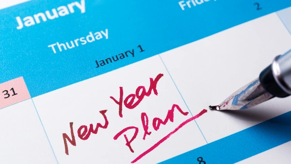 January 1st calendar with "New Year Plan" written in red marker. Calendar Blog Hero.