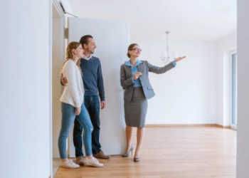 A couple being shown a home by a real estate agent.