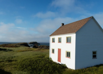 A house overlooks the ocean.