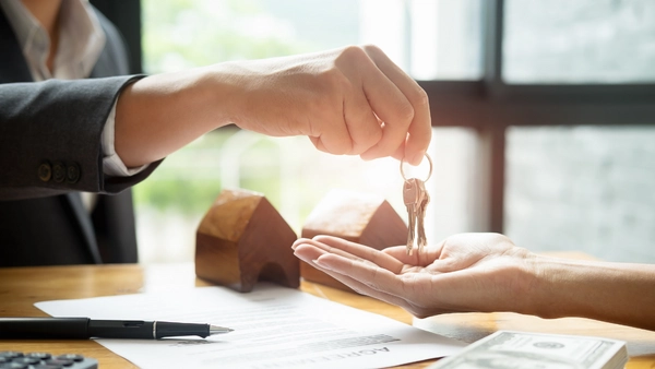Two people exchanging keys