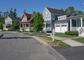 A row of houses on a sunny street in Toronto.