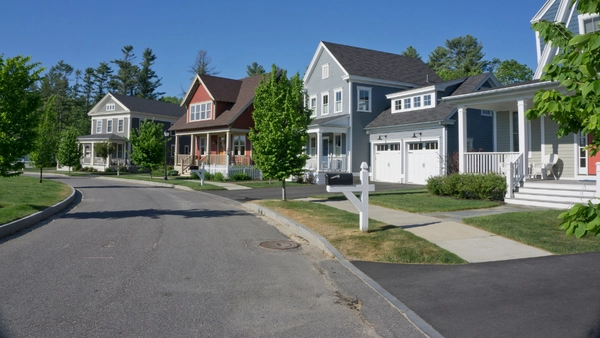 A row of houses on a sunny street in Toronto.