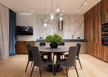 A table and chairs in a house.