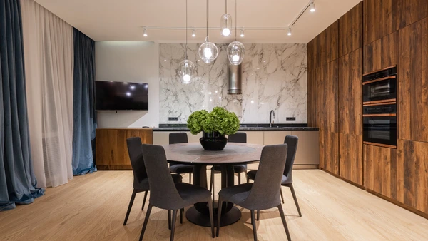 A table and chairs in a house.