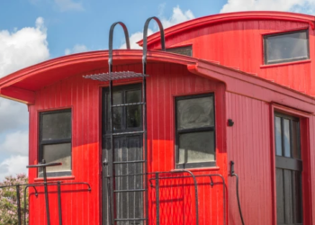 Exterior of a red train caboose