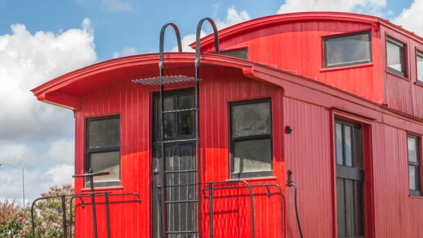 Exterior of a red train caboose