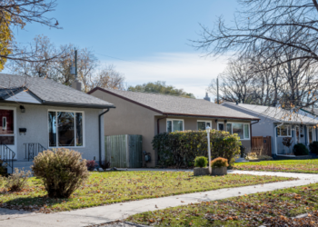 A row of bungalows on a street.