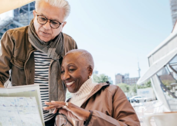 Two older people looking at a map.