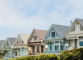 A row of different colored houses