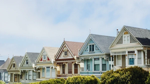 A row of different colored houses