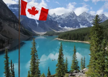 A Canadian Flag swaying in the wind in Banff, Alberta.