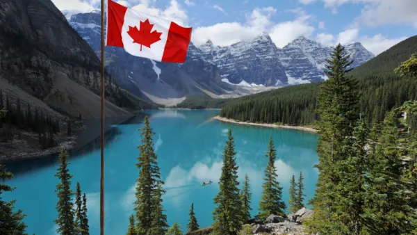 A Canadian Flag swaying in the wind in Banff, Alberta.