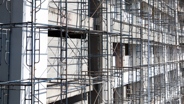 A pre-construction site with metal scaffolding.