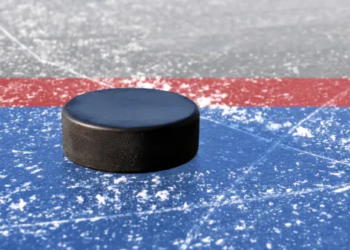 Close up of a hockey puck on ice