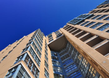 A building as seen from the ground in downtown Toronto.