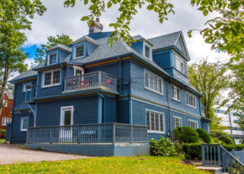 A traditional grey siding house.