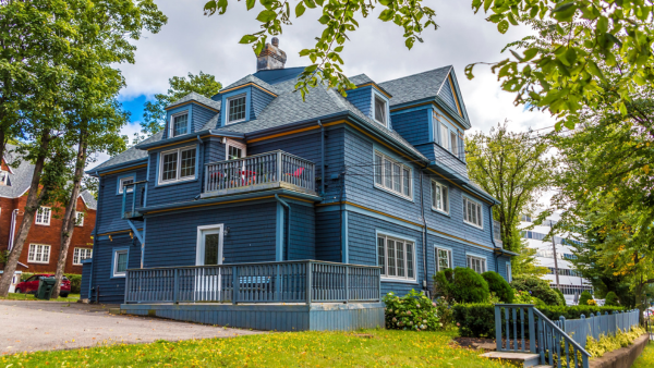 A traditional grey siding house.