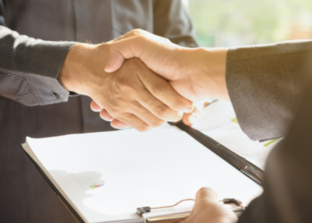 Two people shaking hands.