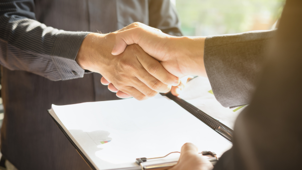 Two people shaking hands.