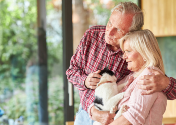 An older couple and their dog.