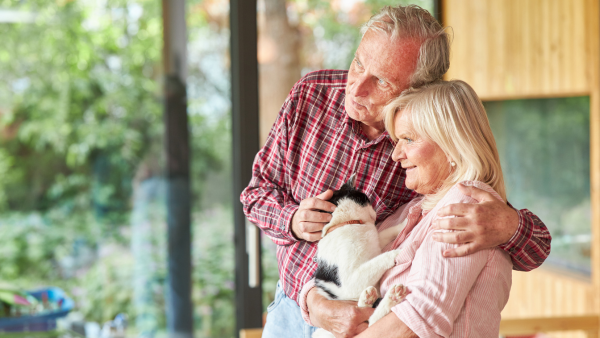 An older couple and their dog.