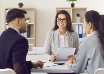 A lender meeting with home buyers.