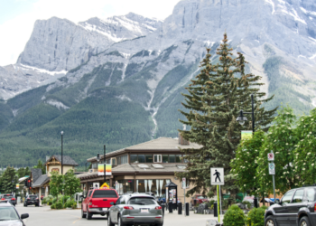 A town in Alberta with mountains in the background.