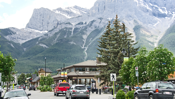 A town in Alberta with mountains in the background.