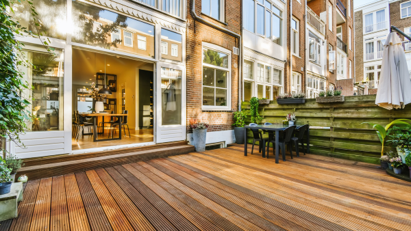 A courtyard with wood flooring.