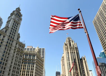American flag waving in Wall Street