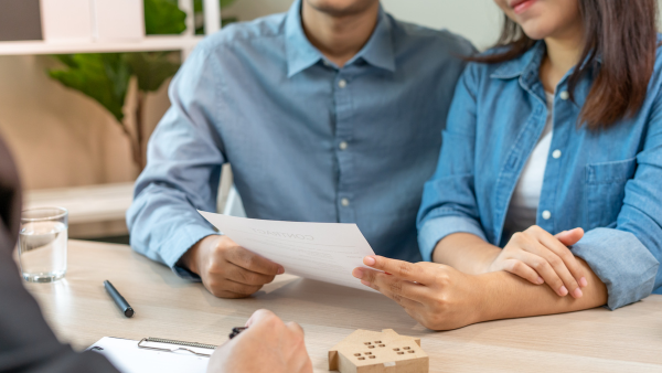 A couple reviewing papers.