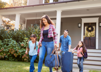 A family leaving their home for vacation.