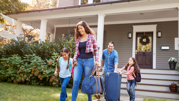 A family leaving their home for vacation.