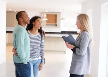 Couple talking to realtor.